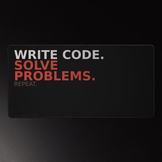 Software developer desk mat on black background with off-white and red typography reading Write Code Solve Problems Repeat