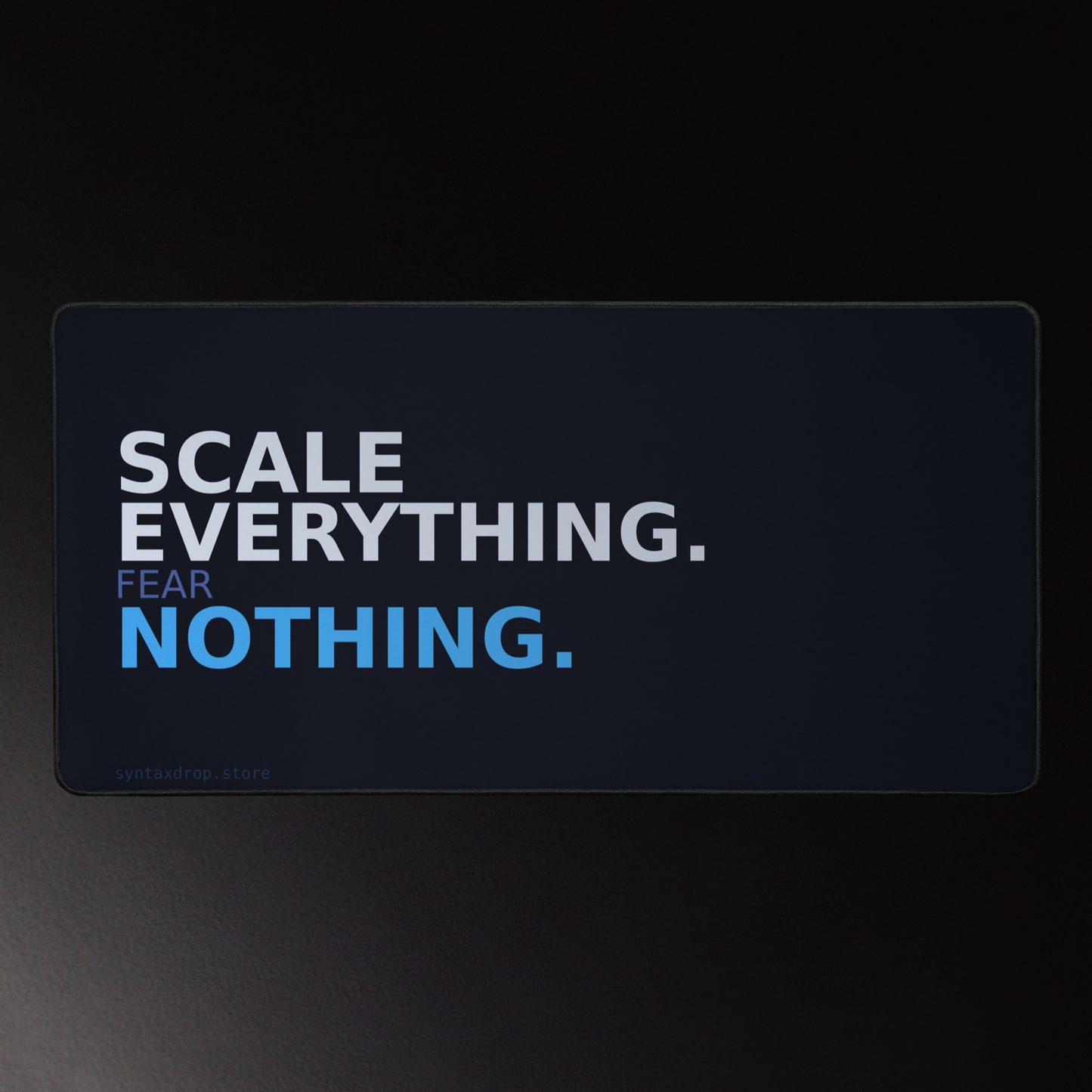 Cloud engineer desk mat on dark navy background with bold white and blue left-aligned typography reading Scale Everything Fear Nothing