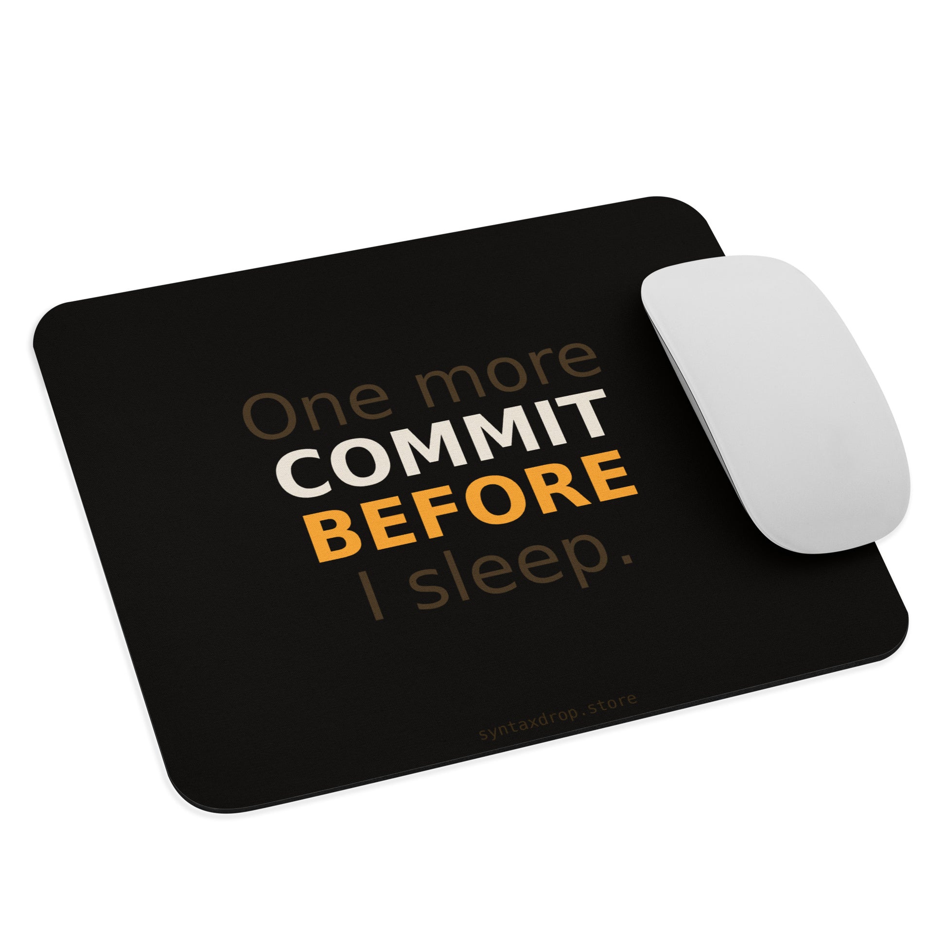 Software developer mouse pad on dark background with bold cream and amber stacked typography reading One More Commit Before I Sleep