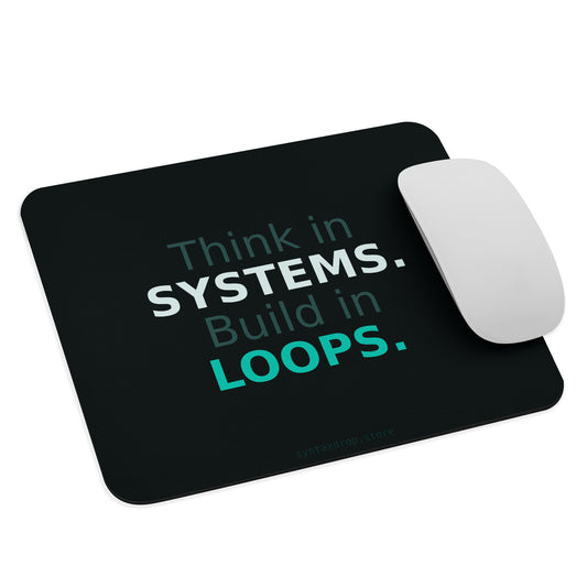 Systems architect mouse pad on dark teal background with bold white and cyan typography reading Think in Systems Build in Loops