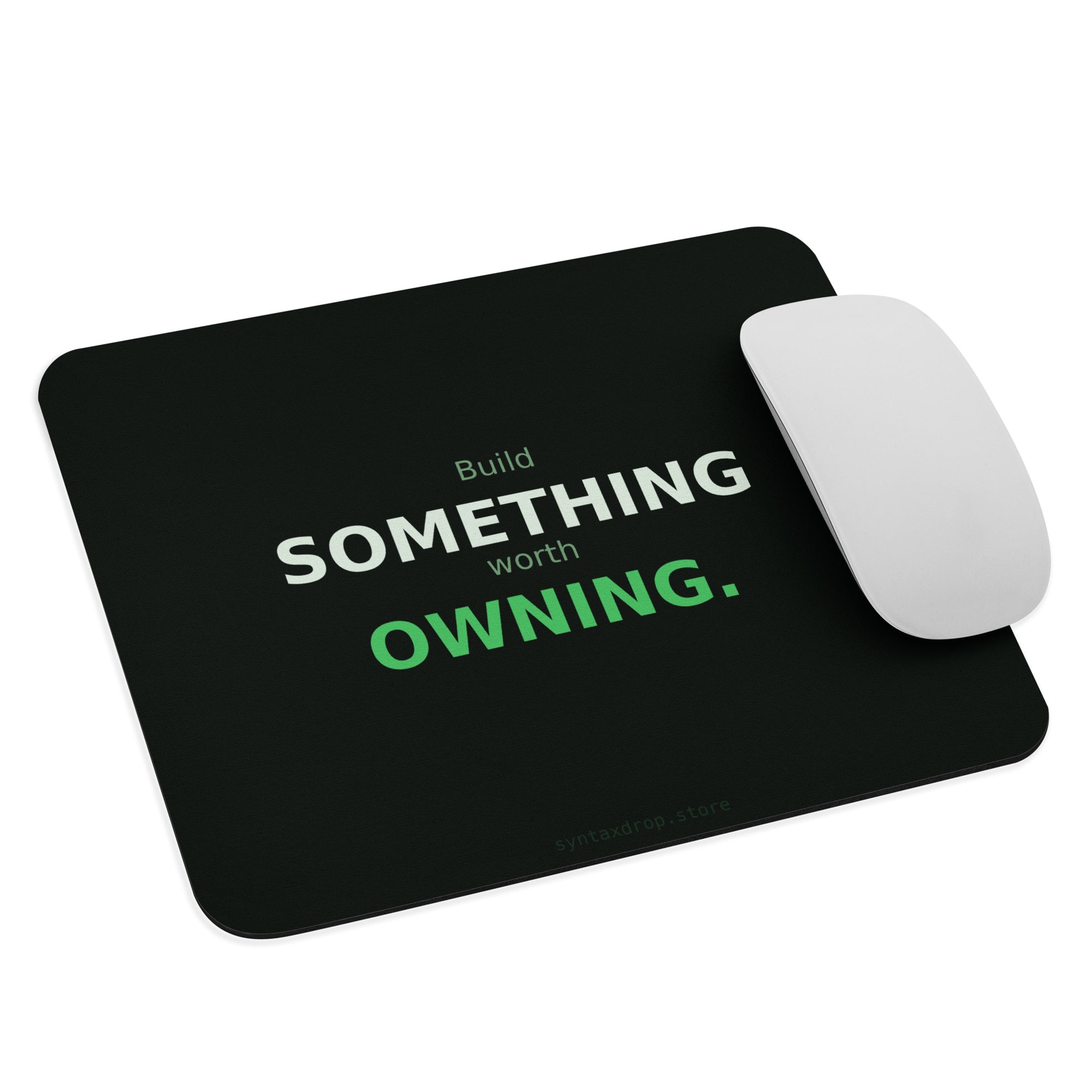 Startup founder mouse pad on dark green background with off-white and green typography reading Build Something Worth Owning